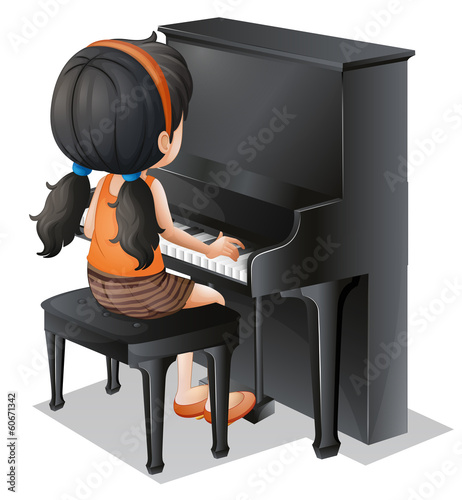 A young girl playing with the piano