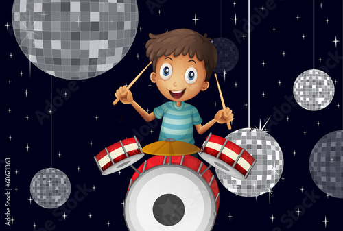 A young drummer at the disco house