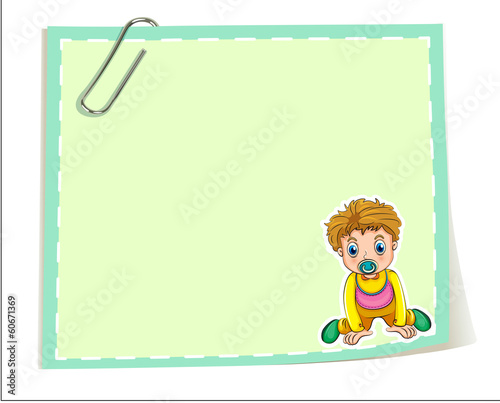 An empty paper template with a paper clip and a young boy