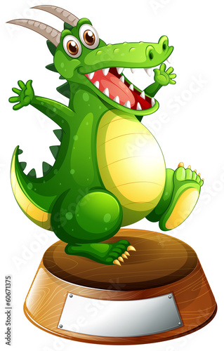 A smiling green dragon above the empty label