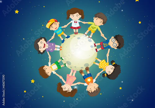 Kids holding their hands together while standing above the Earth