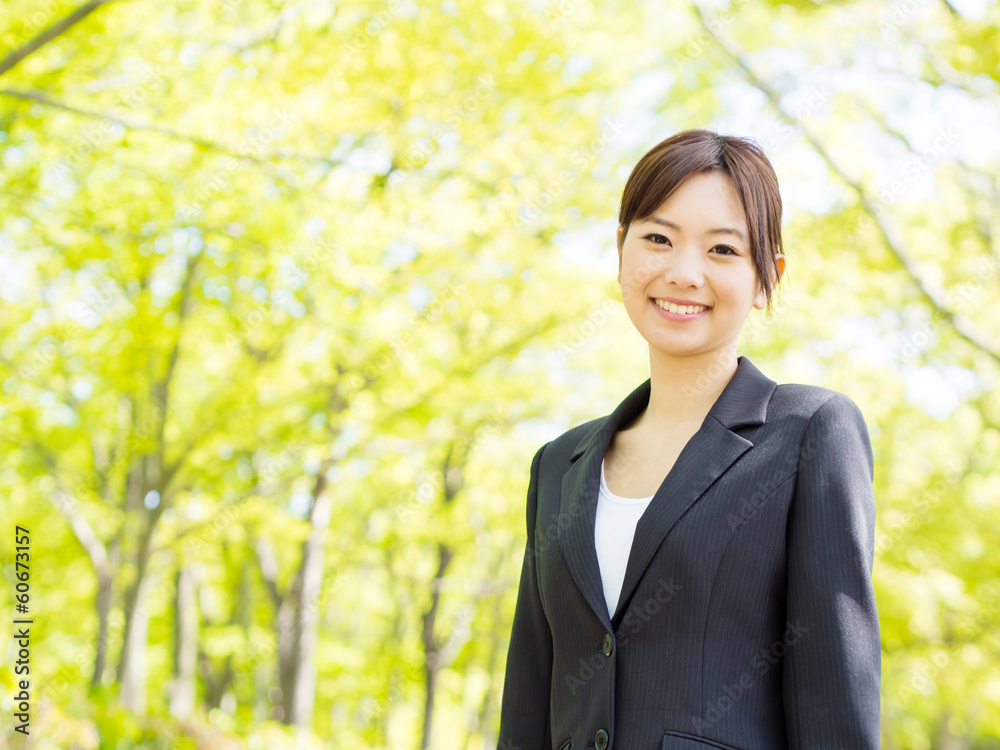 young asian businesswoman relaxing in the park young asian businesswoman relaxing in the park