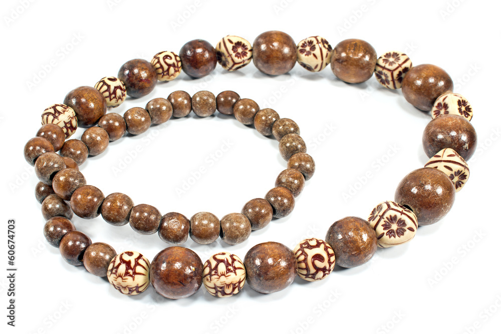 Necklace made of brown wooden balls isolated on white Necklace made of brown wooden balls isolated on white
