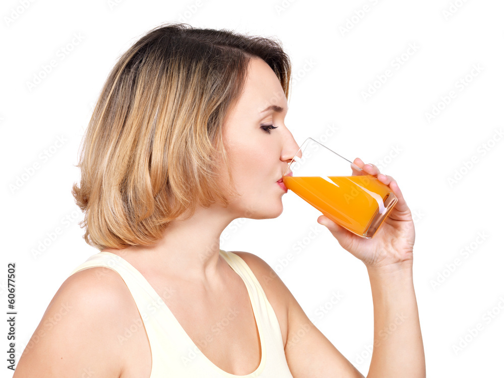 Profile portrait of a young woman drinks orange juice. Profile portrait of a young woman drinks orange juice.
