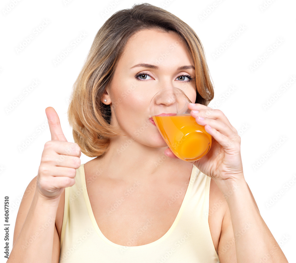 Portrait of a young woman drinks orange juice. Portrait of a young woman drinks orange juice.