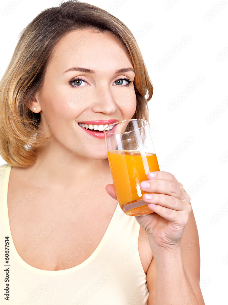 Portrait of a beautiful young woman with a glass of orange juice Portrait of a beautiful young woman with a glass of orange juice
