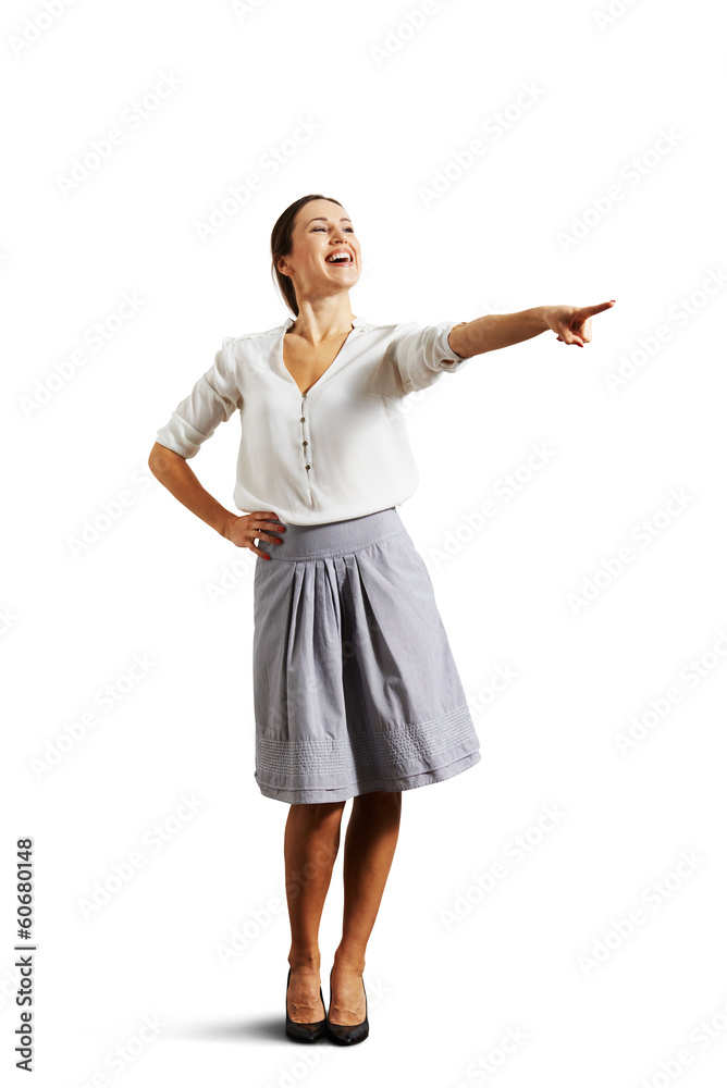 woman pointing at something and laughing woman pointing at something and laughing