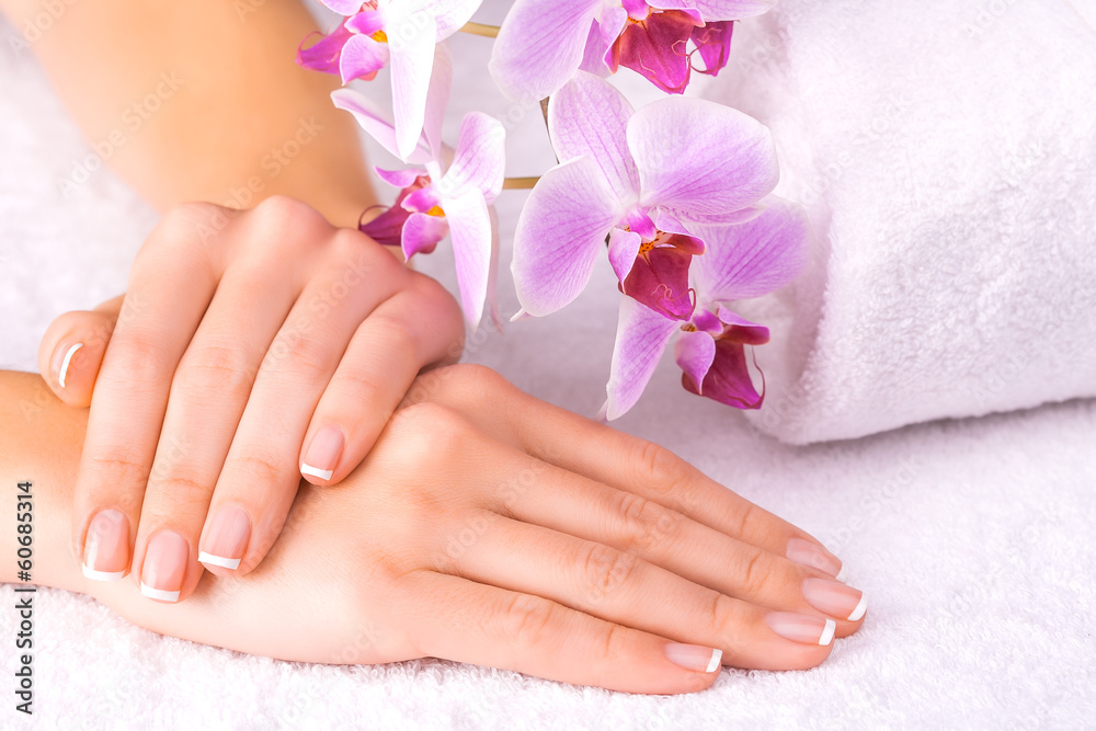 beautiful manicure with pink orchid on the white beautiful manicure with pink orchid on the white