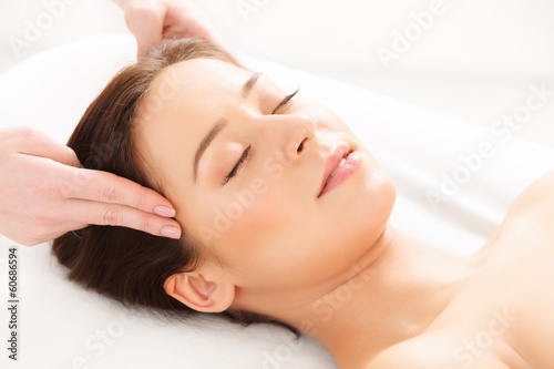 Face Massage. Close-up of a Young Woman Getting Spa Treatment. 