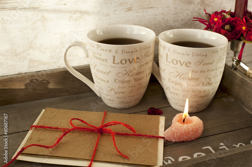 Valentine greeting card with two cups on wooden tray