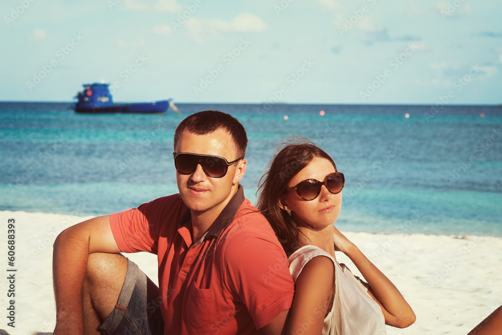 Young couple on the background of the Indian Ocean Young couple on the background of the Indian Ocean