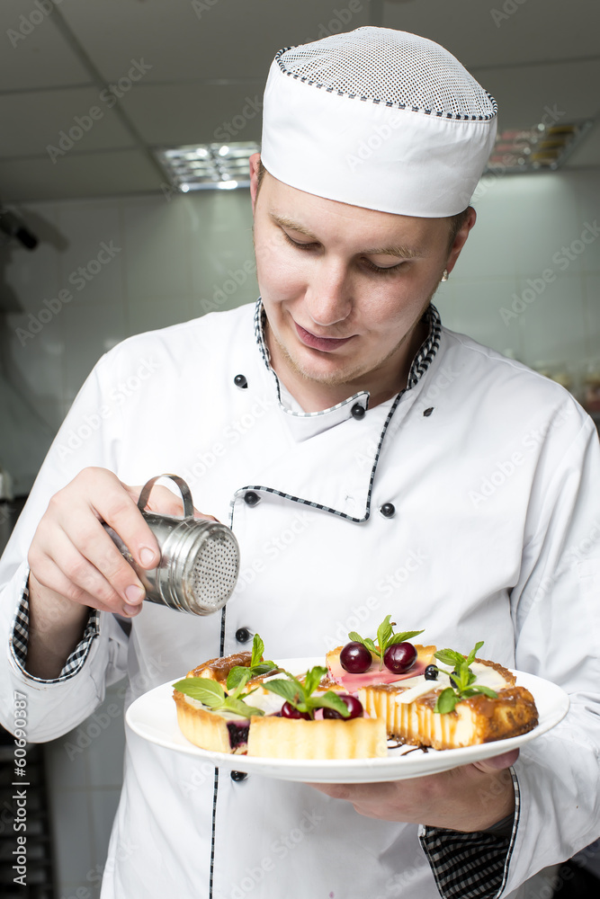chef preparing food in the kitchen at the restaurant chef preparing food in the kitchen at the restaurant