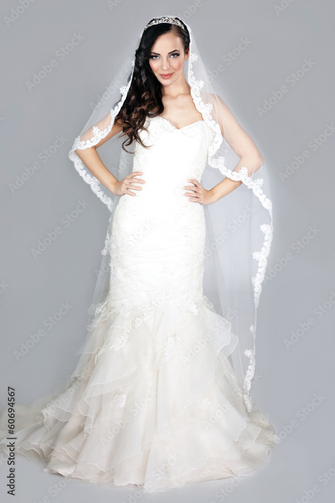 beautiful elegant woman in a white wedding dress posing beautiful elegant woman in a white wedding dress posing