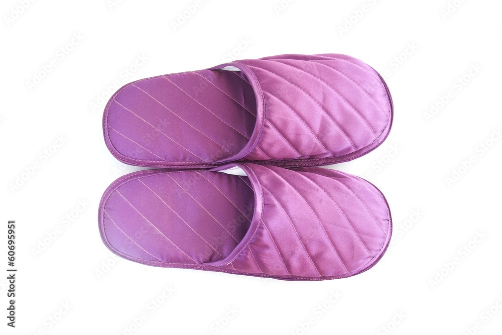 A pair of purple slippers on white background A pair of purple slippers on white background