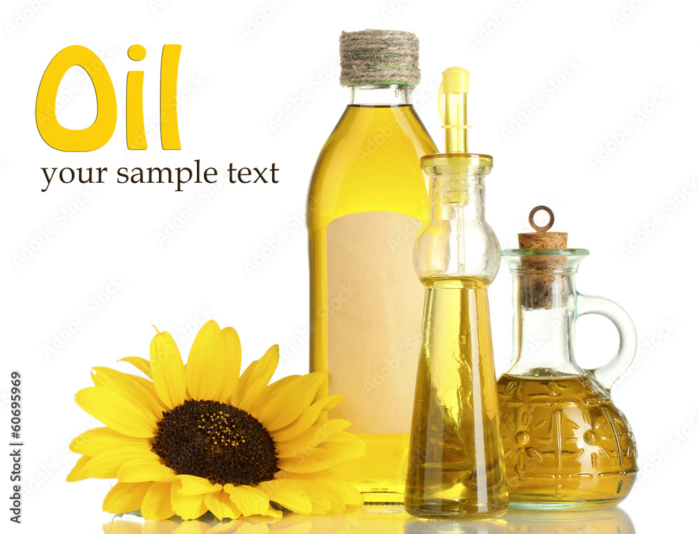 oil in jars and sunflower, isolated on white oil in jars and sunflower, isolated on white