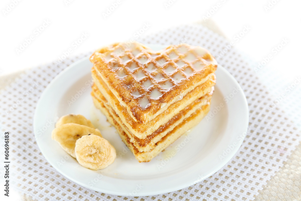 Sweet Belgium waffles with banana, isolated on white Sweet Belgium waffles with banana, isolated on white