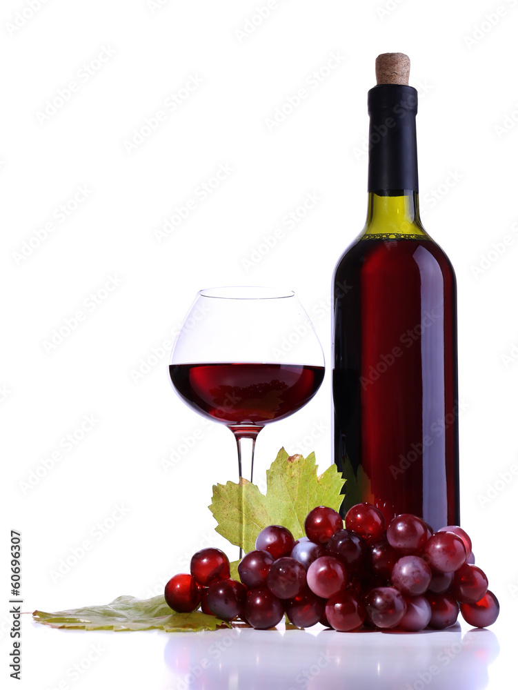 Wineglass with red wine, grape and bottle isolated on white