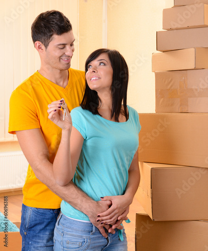 Young couple moves into new...