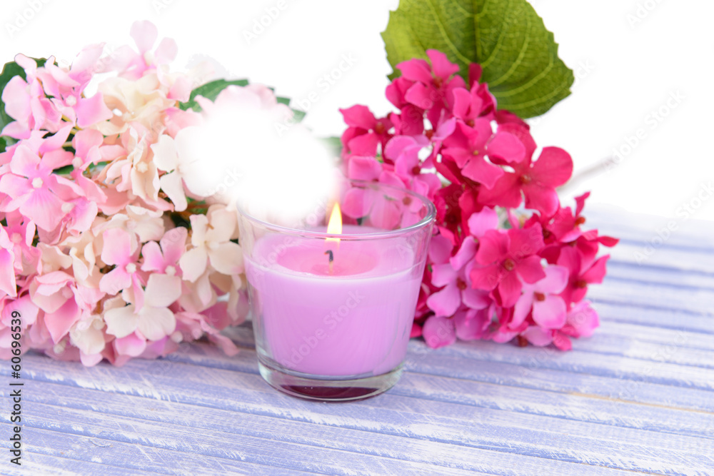Beautiful colorful candles and flower,on color wooden