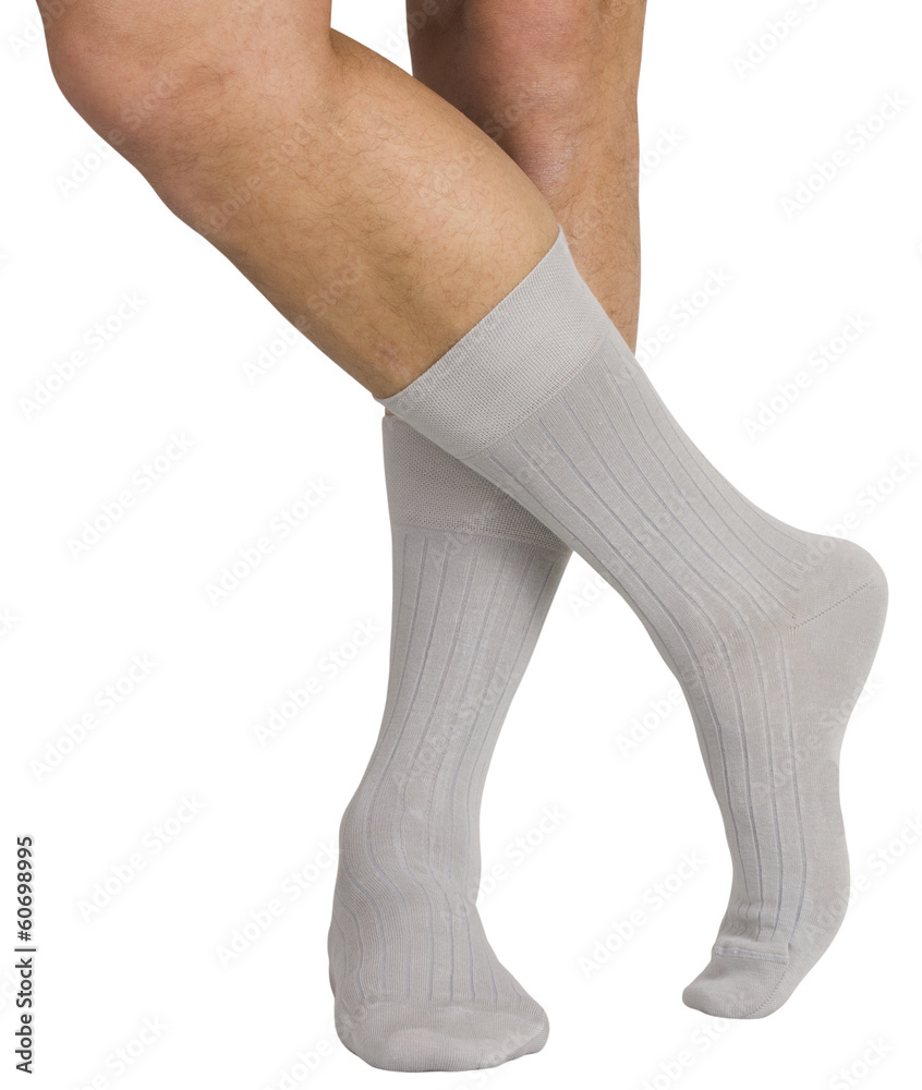 Male legs in socks. Isolated on white background