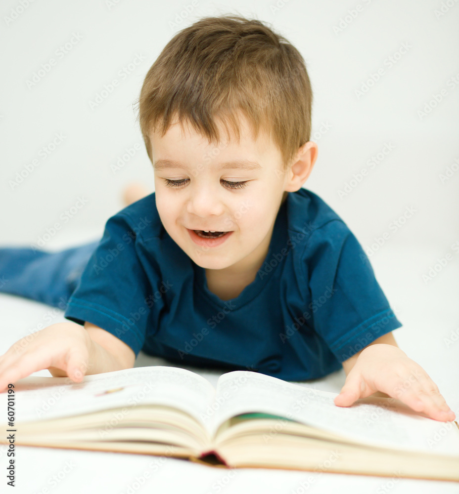 Little boy is reading a book Little boy is reading a book