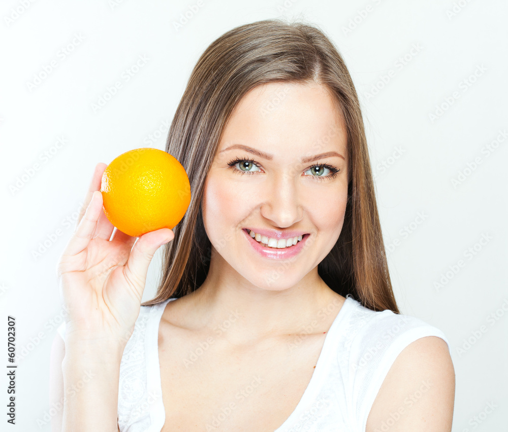 Portrait of a young beautiful woman with orange Portrait of a young beautiful woman with orange