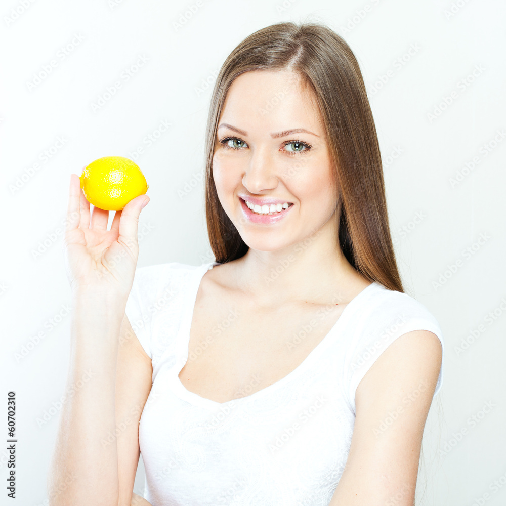 Portrait of young happy smiling woman with lemon Portrait of young happy smiling woman with lemon