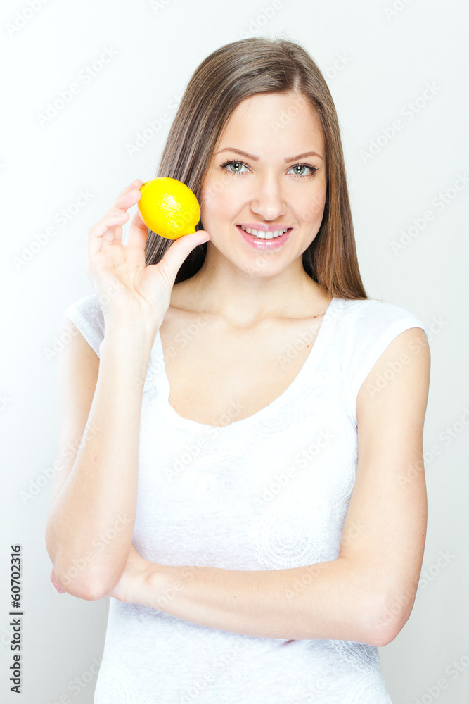 Portrait of young happy smiling woman with lemon Portrait of young happy smiling woman with lemon