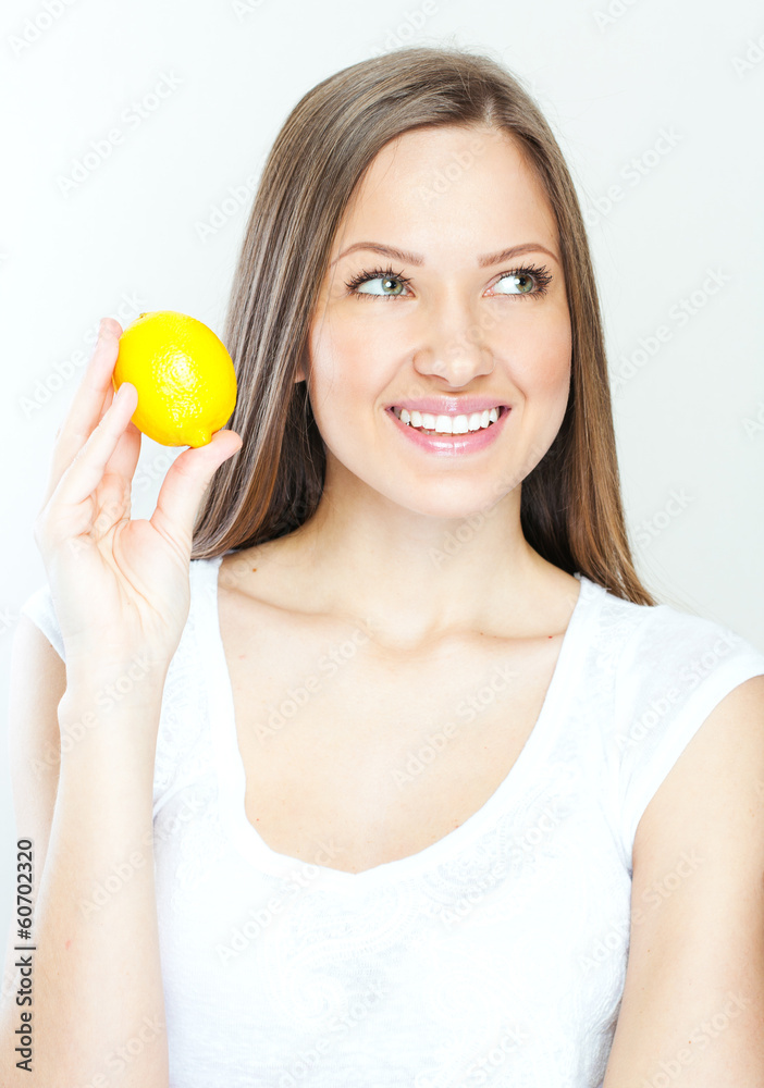 Portrait of young happy smiling woman with lemon Portrait of young happy smiling woman with lemon