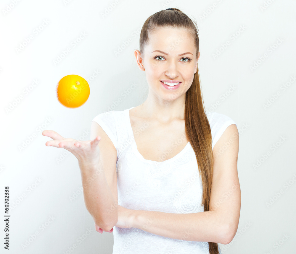 Portrait of a young beautiful woman with orange Portrait of a young beautiful woman with orange