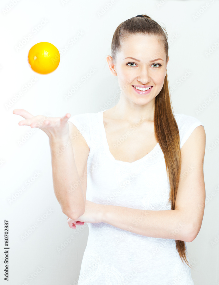 Portrait of a young beautiful woman with orange Portrait of a young beautiful woman with orange