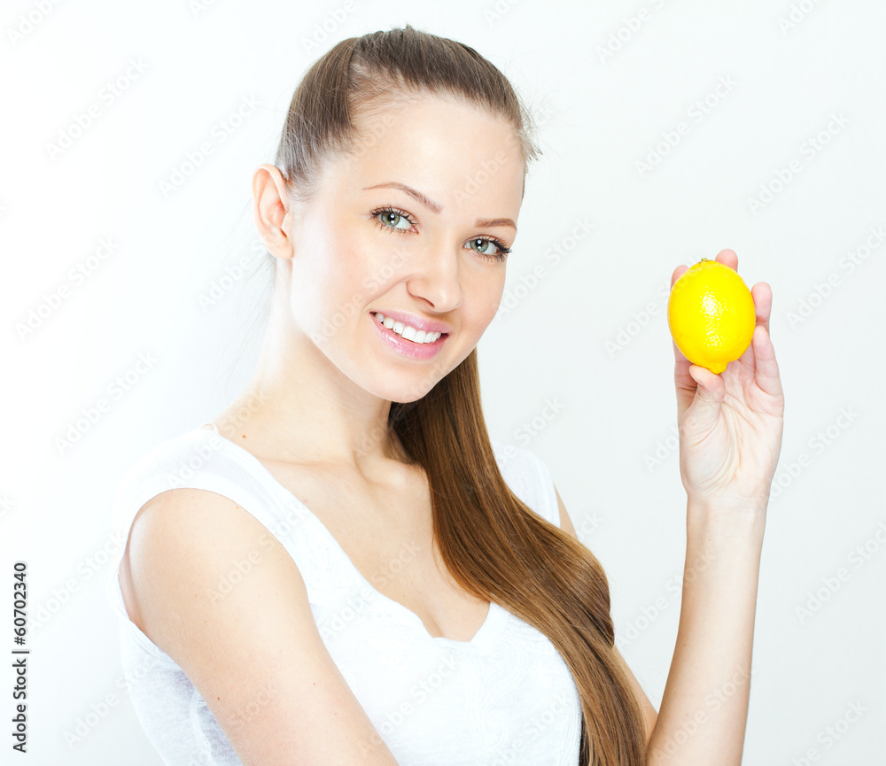 Portrait of young happy smiling woman with lemon Portrait of young happy smiling woman with lemon