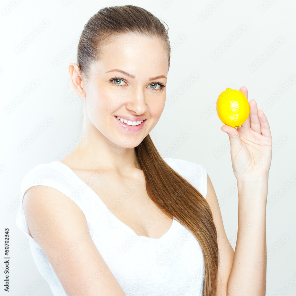 Portrait of young happy smiling woman with lemon Portrait of young happy smiling woman with lemon