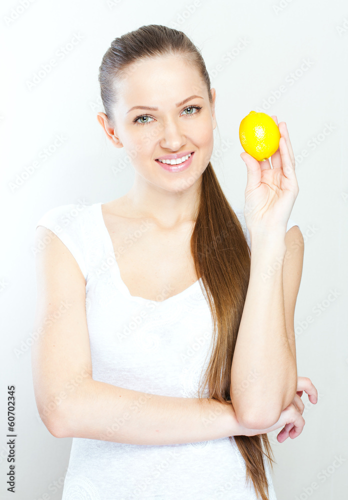 Portrait of young happy smiling woman with lemon Portrait of young happy smiling woman with lemon