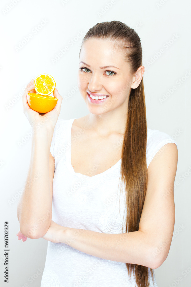 Portrait of a young beautiful woman with orange Portrait of a young beautiful woman with orange