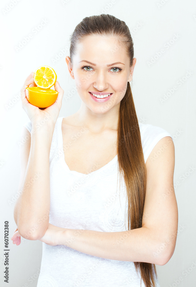 Portrait of a young beautiful woman with orange Portrait of a young beautiful woman with orange