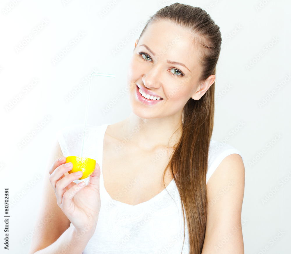 Attractive smiling young woman drinking orange juice straight fr Attractive smiling young woman drinking orange juice straight fr