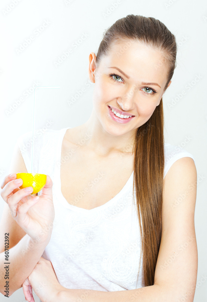 Attractive smiling young woman drinking orange juice straight fr Attractive smiling young woman drinking orange juice straight fr