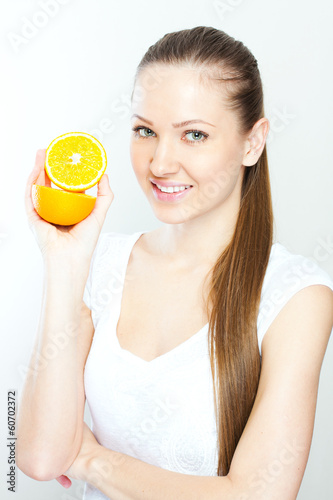 Portrait of a young beautiful woman with orange