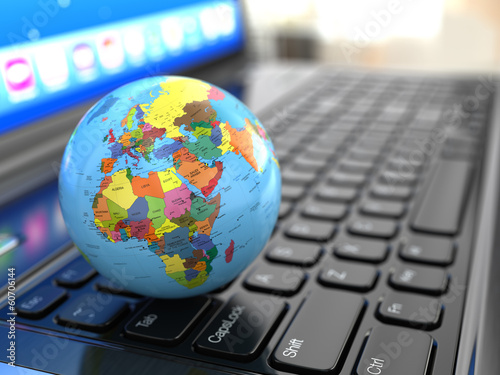 Global communications. Earth on laptop ceyboard.