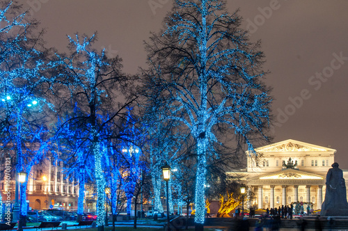 illuminated blue trees near the Bolshoy theatre at night