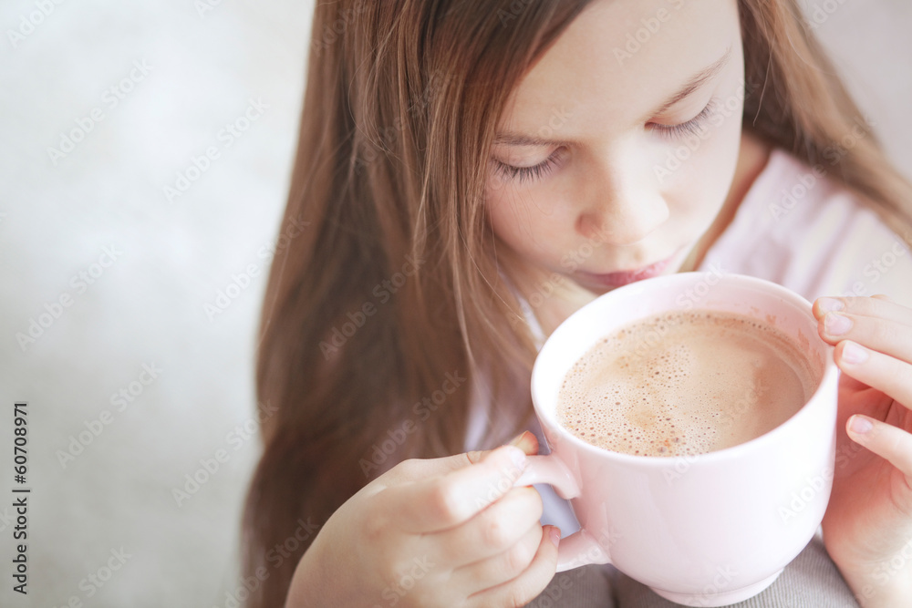 Child drinking cocoa Child drinking cocoa