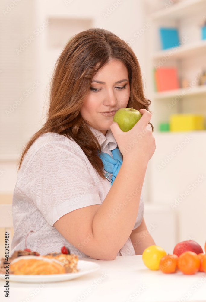 Young woman choosing a diet Young woman choosing a diet