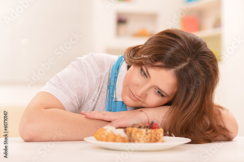 Young woman dreaming about cake