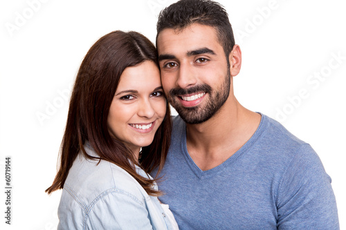 Couple posing over white background