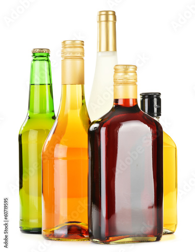 Bottles of assorted alcoholic beverages isolated on white