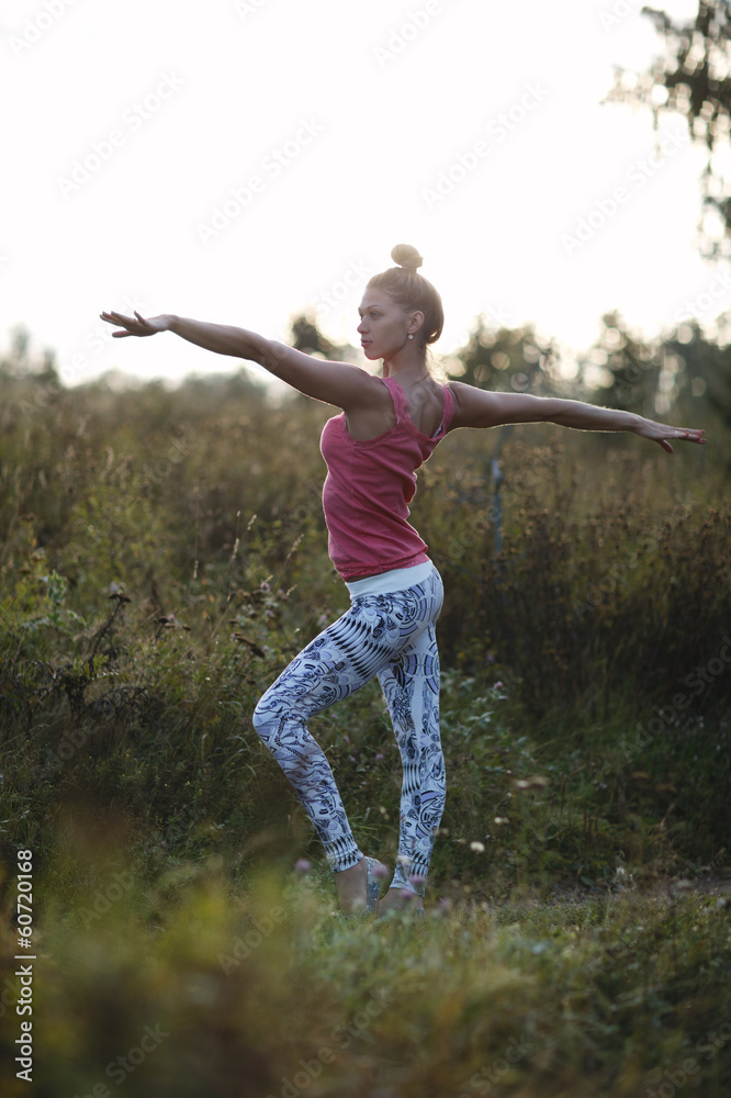 Young ballerina or gymnast practising in the park Young ballerina or gymnast practising in the park