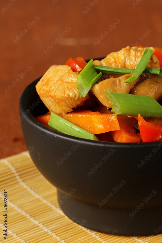 Stir-Fry chicken with vegetables in sweet and sour sauce Stock Photo