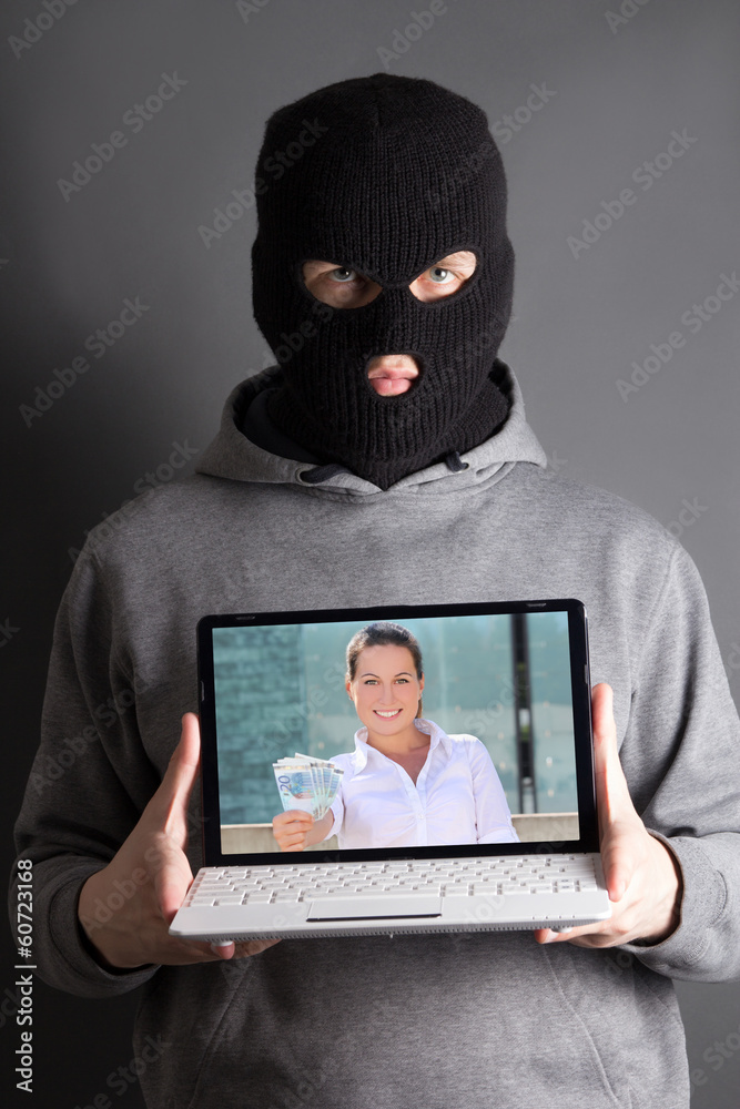 masked man with computer with picture of woman giving money masked man with computer with picture of woman giving money