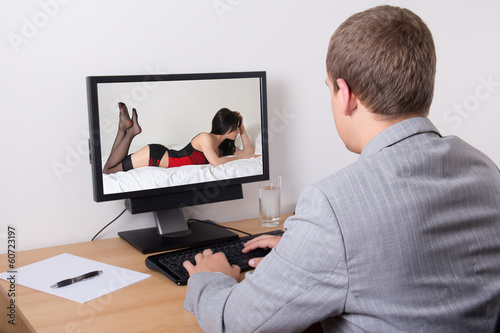 businessman watching porn in computer at work